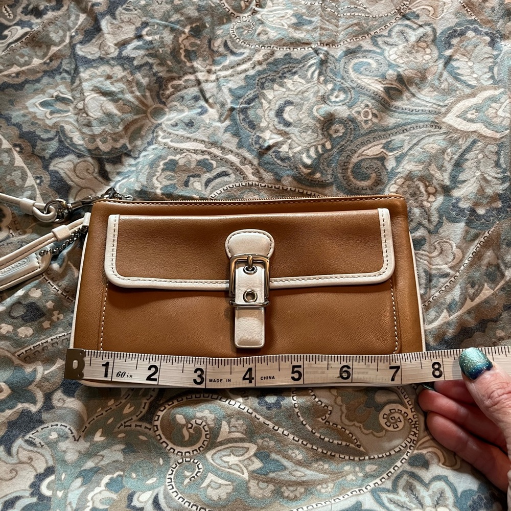 Like new in Used coach tan wristlet